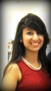 One of our board members models the pearl necklace at an AWISGCH event